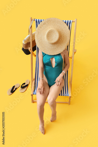 Young woman in swimsuit wit...