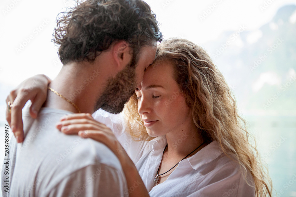 Fototapeta premium Tender embrace by serene waters.
