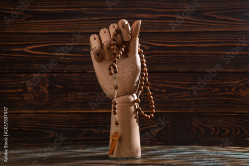 Mannequin hand with rosary ...