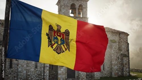 Moldova flag waving in front of church