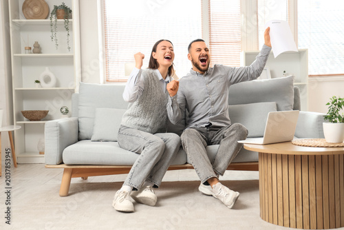 Happy couple with refund fo...