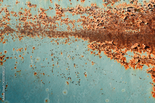 Schilderij op canvas Grunge background of a rusty metal sheet with remains of peeling turquoise paint