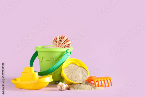 Seashells, sand, beach toy ...