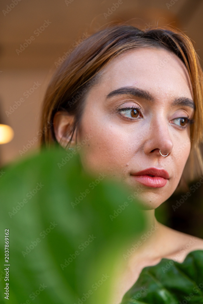 Fototapeta premium Contemplative woman with nose ring