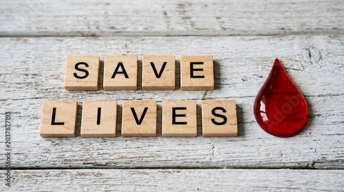 Save lives message with red blood drop symbol