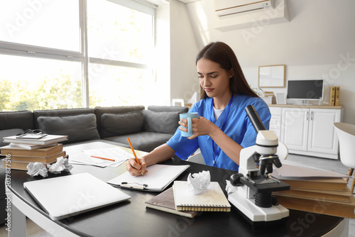 Tired female medical intern...