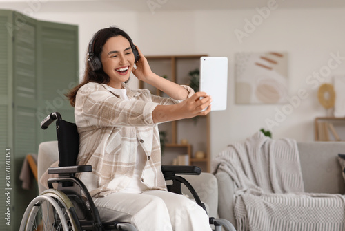 Young woman in wheelchair w...