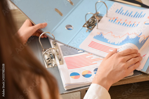 Businesswoman reviewing fin...