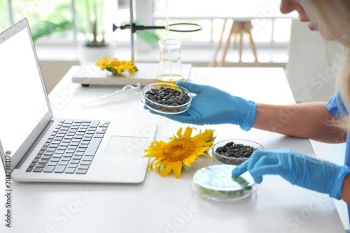 Female scientist with sunfl...