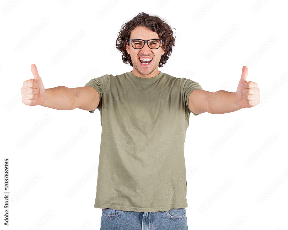 Naklejka premium Excited young man shows thumbs up positive gesture, looking overjoyed to camera. Casual guy, curly hair wearing glasses gives approval symbol isolated on transparent background