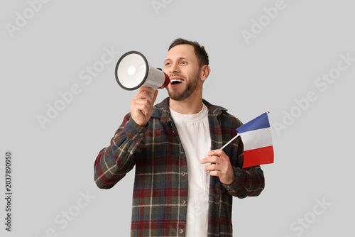 Young man with flag of Fran...
