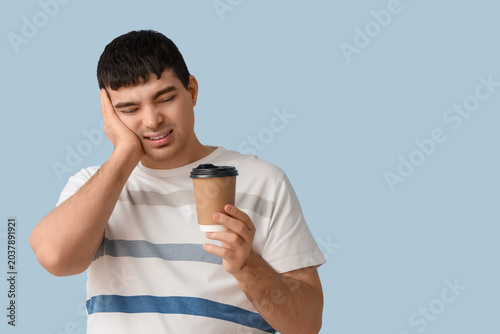 Young man with coffee cup s...