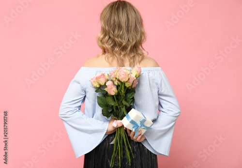 Young woman with bouquet of...