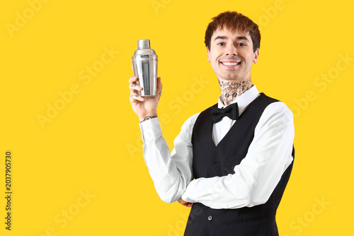 Young male bartender with s...
