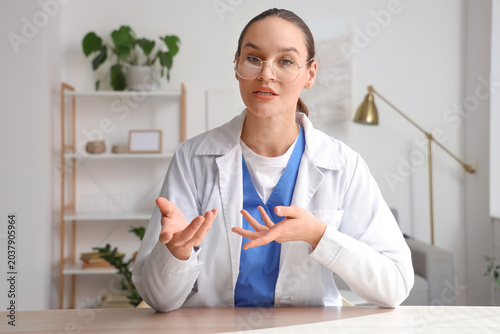 Female doctor video chattin...