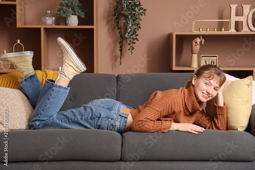 Young woman relaxing on sof...