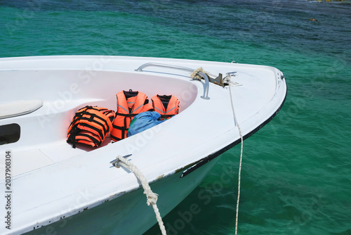 Boat with life jackets on the water.