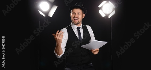 Male actor with movie scrip...