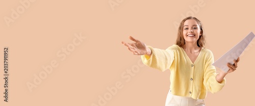 Canvas Print Beautiful actress with movie script on beige background with space for text