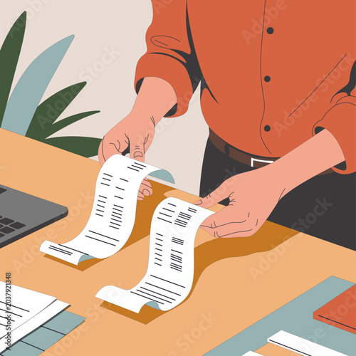 Business Owner Reviewing Receipts at Desk