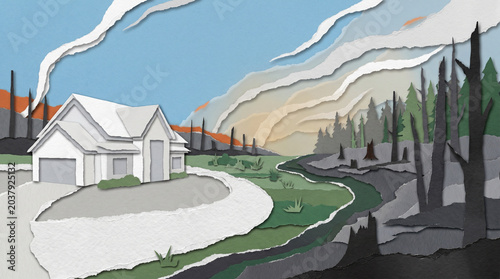 House with defensible space surrounded by burned landscape and smoke  