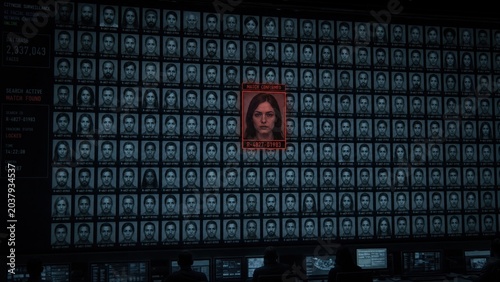 Surveillance system showing facial recognition of a woman on a digital monitor. Identification of a suspect from a database by police. Cyber security, criminal investigation and privacy.