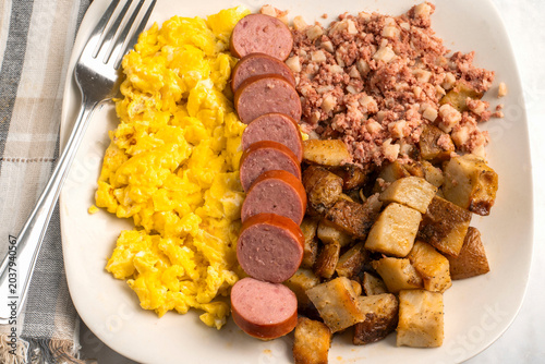 scramble eggs  with kielbasa and corn beef hash