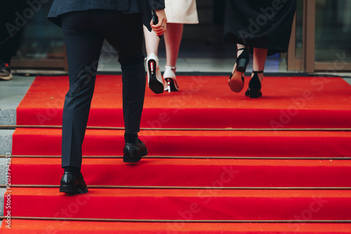 Staircase stairs with red carpet, ropes and golden barriers, luxury party entrance decorations, cinema premiere film festival event award gala, opening ceremony, wealthy rich guests arriving on steps