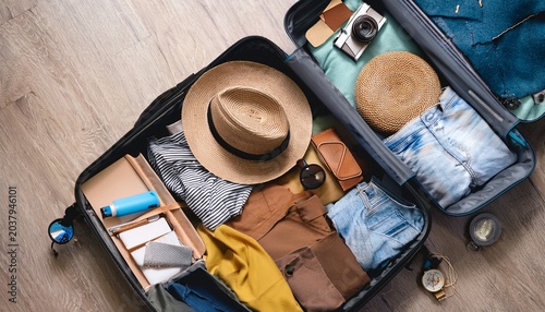 packing essentials for travel suitcase organization tips home lifestyle flat lay travel preparation