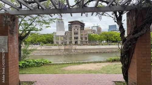 Hiroshima, Japan famous A-Bomb dome (atomic bomb dome) building, framed by wisteria