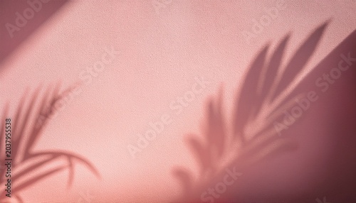 blurred shadow from palm leaves on the light pink wall minimal abstract background for product presentation spring and summer