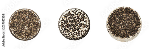 Fotografie Collection of top view of a delicious round baked cookies or crispy sweet biscuits heavily covered with crunchy black and white crushed chocolate cookies crumbs, isolated white background