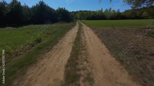 FPV Drone Flight Over Rural Agricultural Fields and Forest