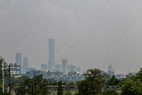Skyscrapers and buildings shrouded in smog. Heavy air pollution in Beijing - China. Beijing Dontown (CBD) and China Zun