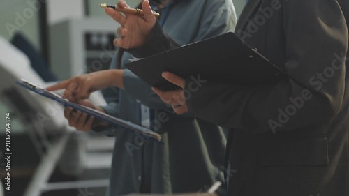 Auditor and accountant working in office Analyze financial data and accounting records with a calculator. Accounting companies provide financial and tax planning services. Close-up pictures