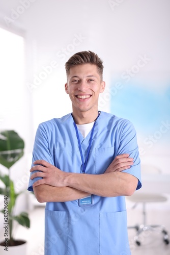 Foto Portrait of medical assistant in scrubs at clinic