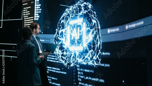 Photos Engineering team looks at AI machine learning self writing code on screen, autonomy concept, Teamworking colleagues reviewing self sustaining artificial intelligence model, doing brainstorming
