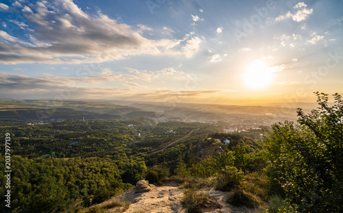 View of the mountains and Kislovodsk from the observation decks of the Kislovodsk Park. Evening sunset over the mountains of Kislovodsk.