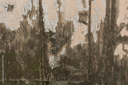 Foto Weathered Wooden Wall with Peeling Paint Texture