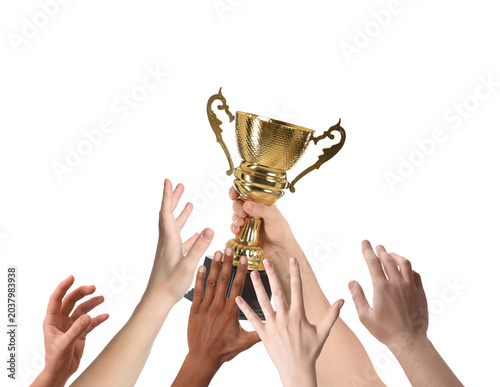 Tableau sur toile People reaching for gold cup held by winner against white background, closeup