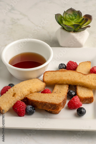 french toast sticks  with  raspberries and blueberries