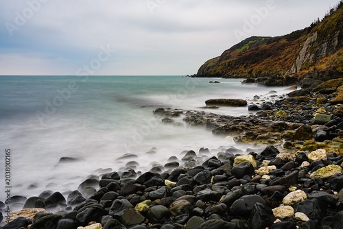 Misty Seascape with Rocks and Rugged Coastal Cliffs