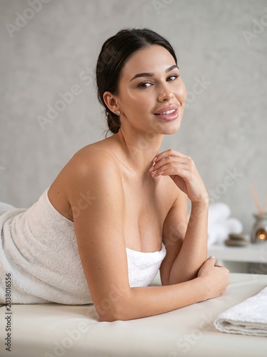 Beautiful young woman radiant with health and serenity, enjoying a luxurious spa treatment and self-care moment, embodying ultimate relaxation and rejuvenation on a wellness journey
