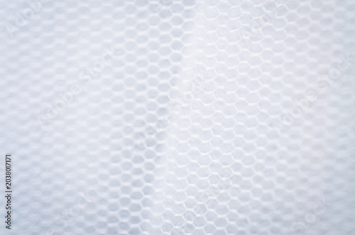 Close up of white honeycomb mesh fabric texture