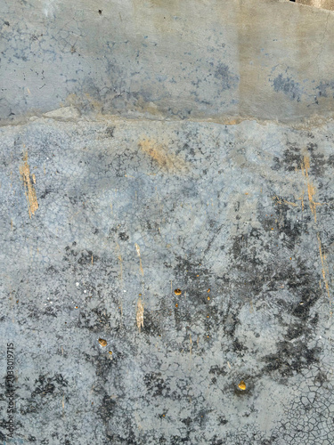 Weathered urban canvas revealing layers of time and environmental markings