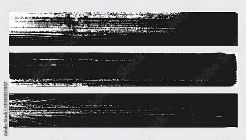 Set of three horizontal black brush stroke textures with distressed edges and grainy effect, isolated on white background
