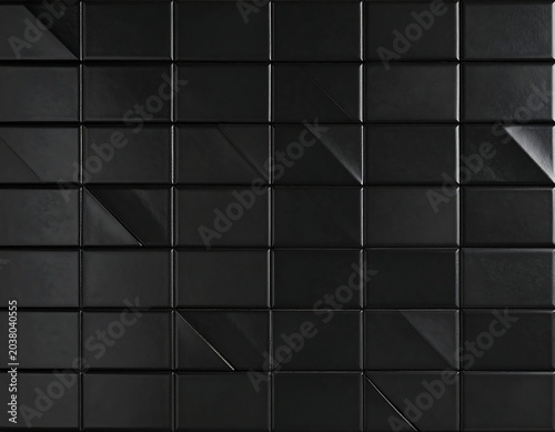 Dark, textured, square tiles.  Geometric pattern of black squares, angled facets