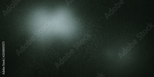Fényképezés Mysterious ethereal light illuminates a textured, dark surface, evoking a sense of intrigue and the unknown