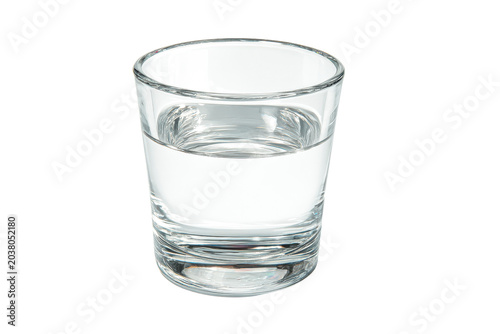Clear glass filled with transparent liquid on black background water