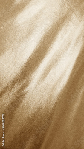Abstract light pale muted gold golden beige white fabric background. Elegant luxury textile backdrop. Shiny glossy. Gradient. Copy space.Cosmetic jewelry product design.Empty blank minimal template ad